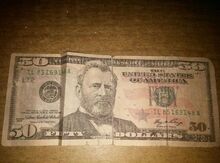 50 dollar əsginasları