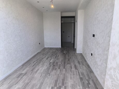 2-room new-build apartment for sale in Qurtuluş 93 residence, 58 m², 74 000 AZN, photo 4 / 12