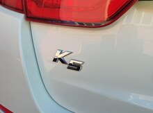 "Kia K5" loqosu 